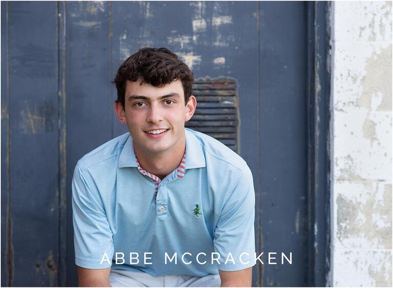 Senior portrait of a boy in downtown Matthews, NC