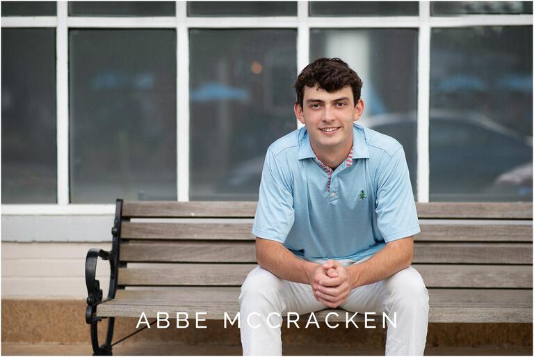 Teenage boy sitting on a bench