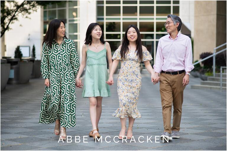 Candid family portrait walking in Uptown Charlotte near the Mint Museum