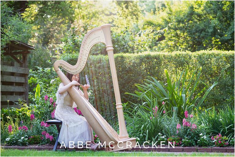 Senior pictures with harp, location is Winghaven Gardens