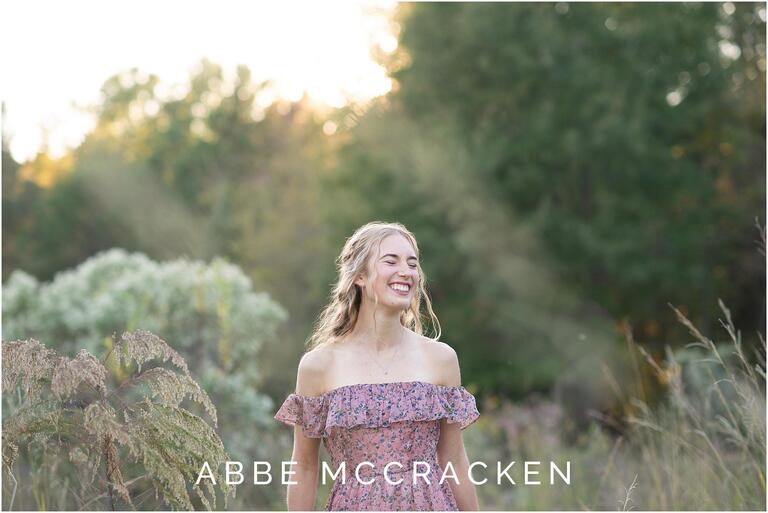 Candid image of a high school senior in the wheat fields at Marvin Efird Park - Charlotte, NC
