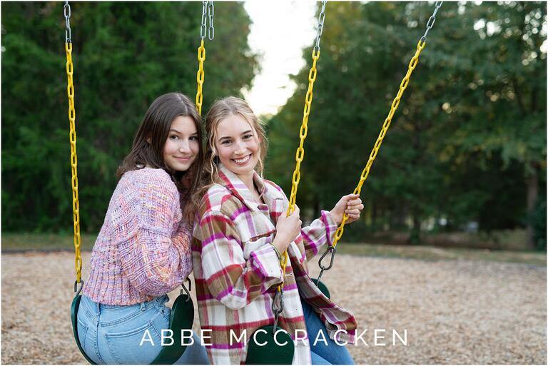 Teenage sisters on the swings at Marvin Efird Park in Waxhaw.