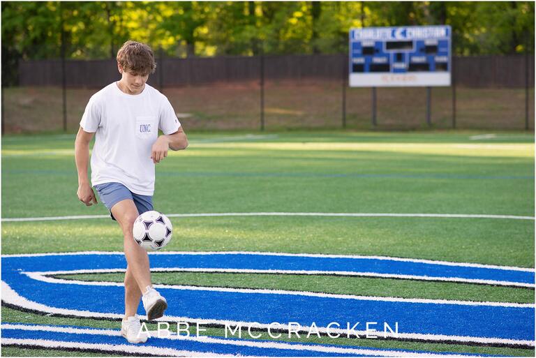 High school senior soccer player on the field at Charlotte Christian School