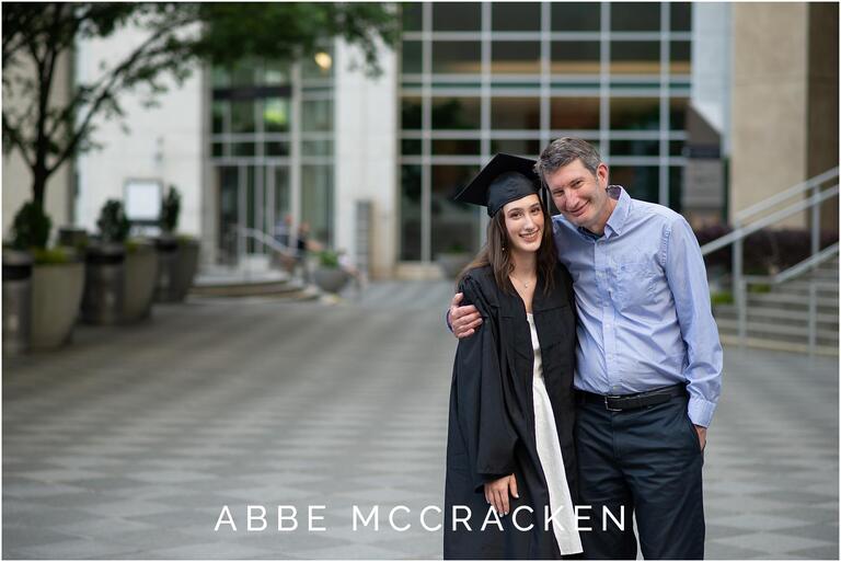 Picture of a father hugging his high school grad daughter