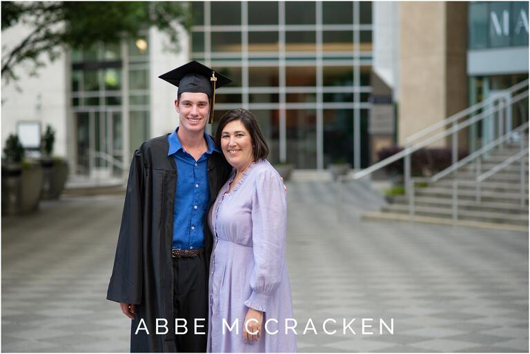 Mother and son portrait, son wearing high school cap and gown