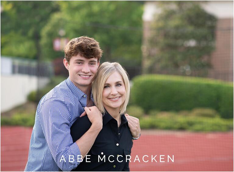 Recent Charlotte grad with his mom at senior session