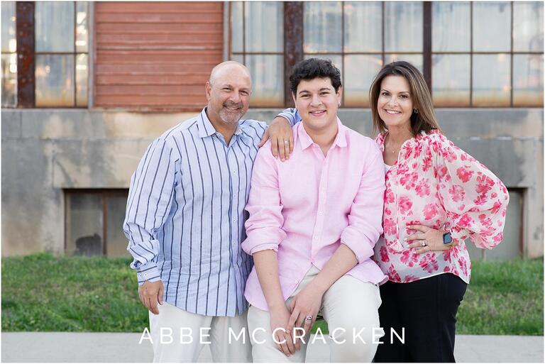 Recent high school graduate pictured with his parents at Camp North End in Charlotte