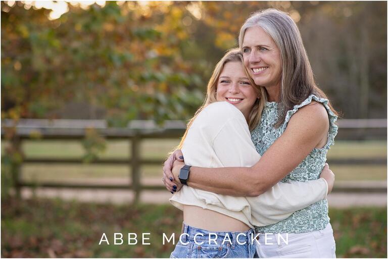 Mother and daughter picture of mom hugging her high school senior