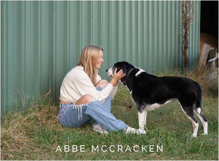 Portrait of a blonde girl and her farm dog