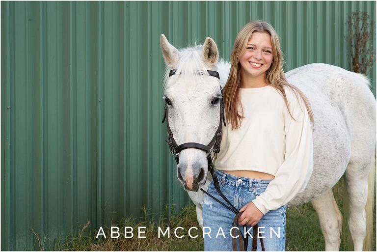 High school senior and her white horse