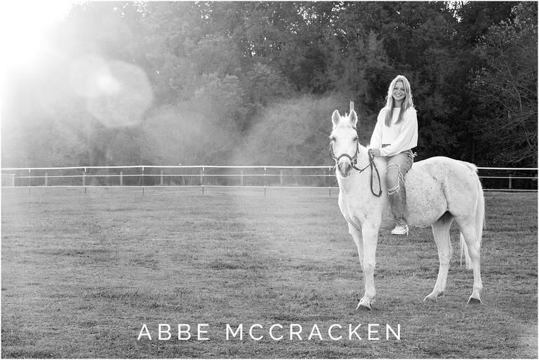 Senior portraits with a white horse, gorgeous lens flare