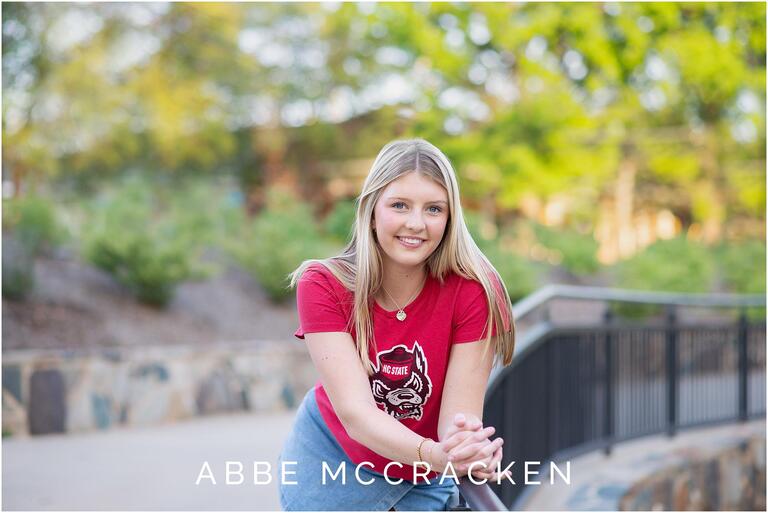 Myers Park senior wearing her NC State t-shirt to celebrate high school graduation