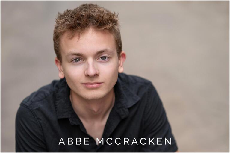Headshot of a senior boy with hazel eyes