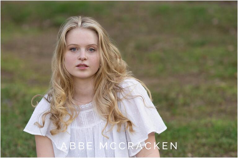 Stunning senior portrait of girl looking straight into camera